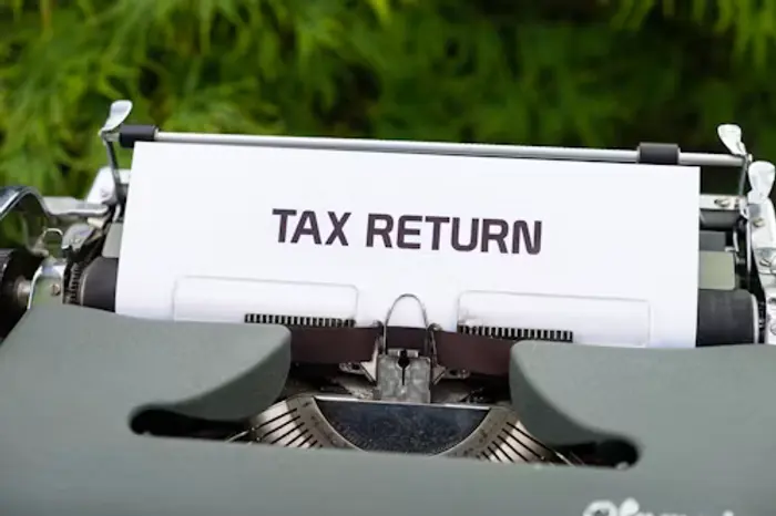 Typewriter with a Tax Return document
